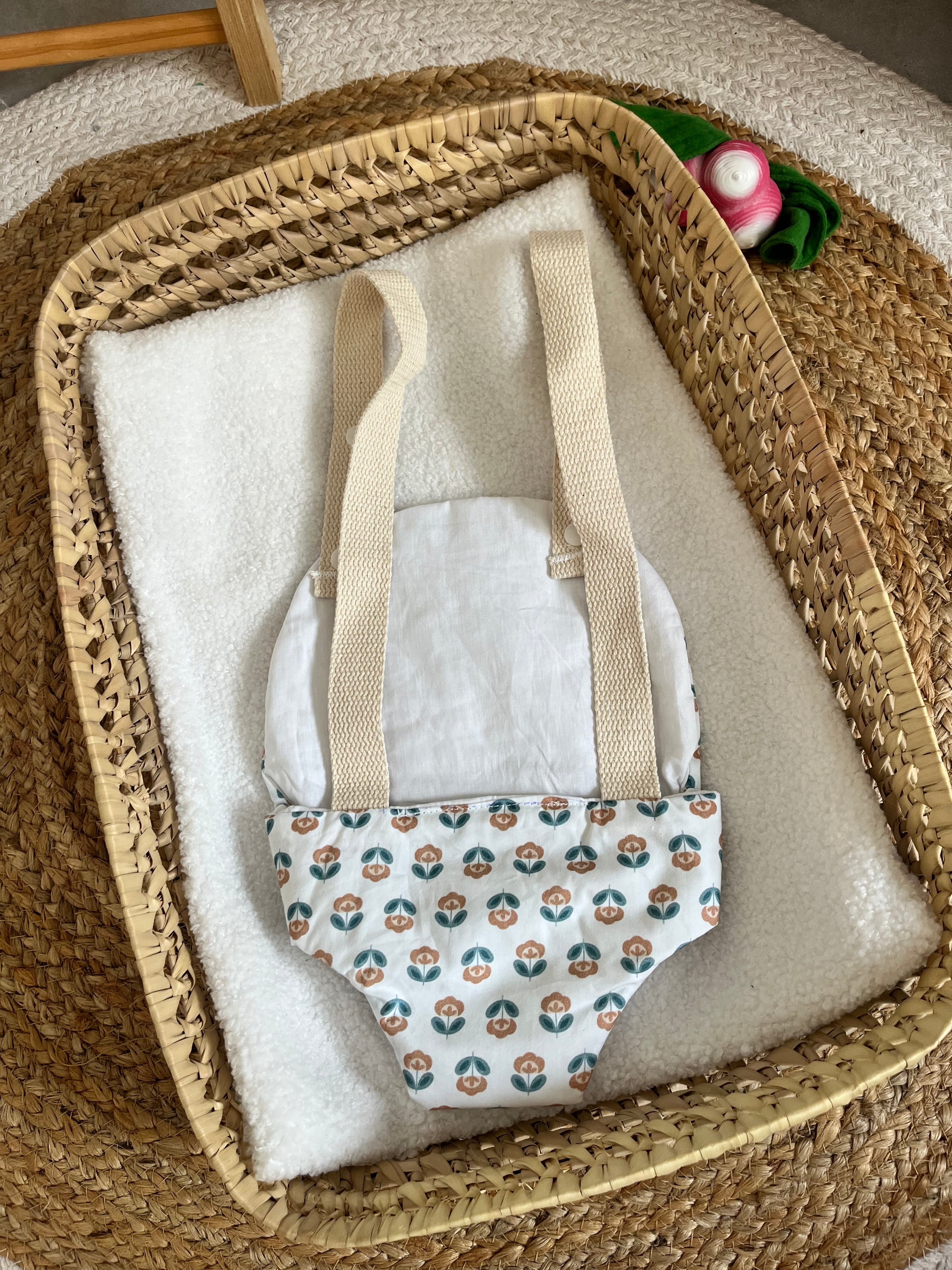 Porte bébé /poupée fleur