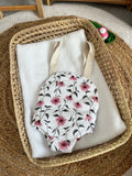 Porte bébé /poupée fleur