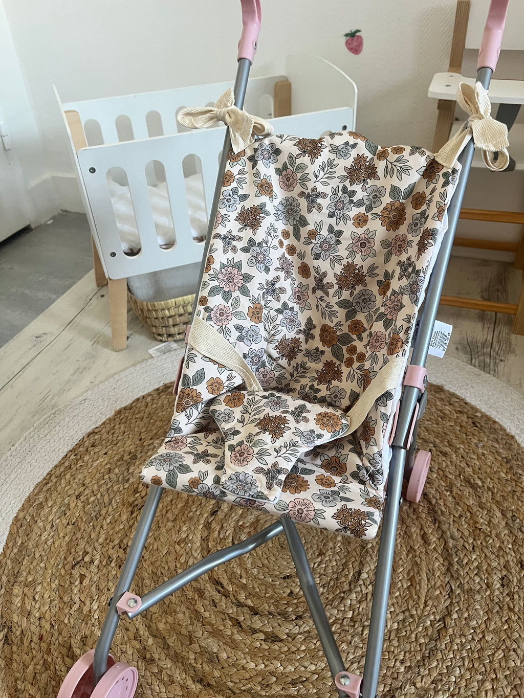 Housse poussette fleuri