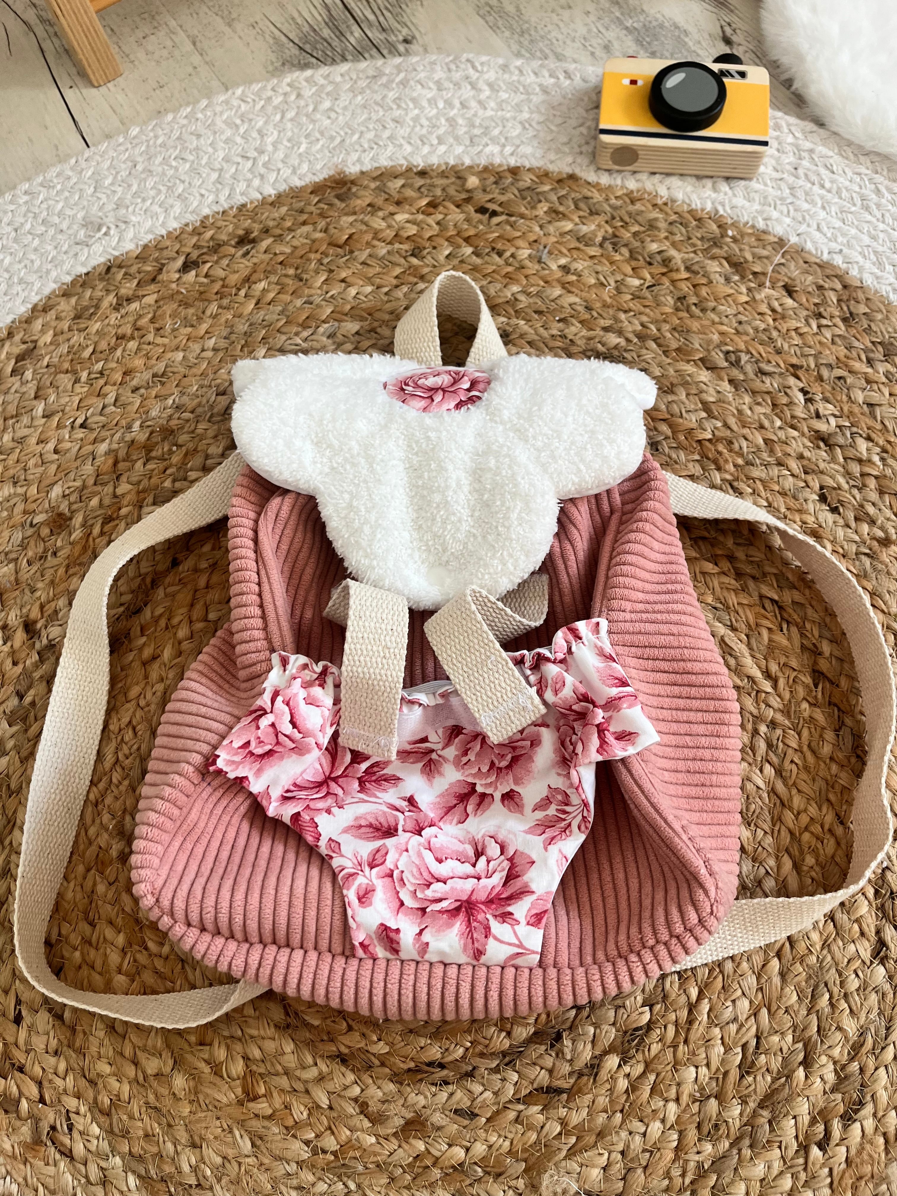 Sac à dos / porte poupée rose